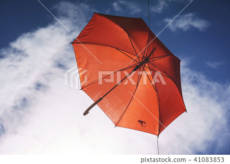 umbrella flying on a blue sky 41083853