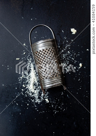 Parmesan cheese with a grater 41084159