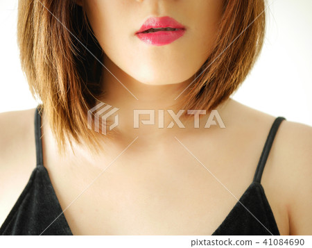portrait young woman applying or wearing lipstick portrait young woman applying or wearing lipstick 41084690