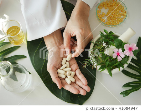 scientist or doctor making herbal medicine 41084947