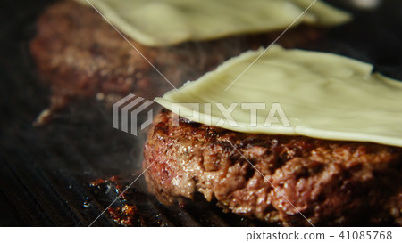 Beefsteak with cheese fries on a grill Beefsteak with cheese fries on a grill 41085768