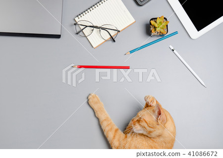 Office table with notepad and pencil.  41086672