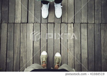 aerial of two people standing opposite on wood aerial of two people standing opposite on wood 41088519