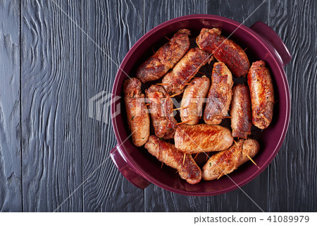 fried rolls of pounded beef steaks 41089979