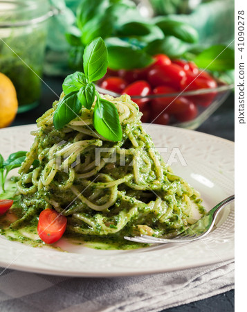 Vegetarian pasta spaghetti with basil pesto 41090278
