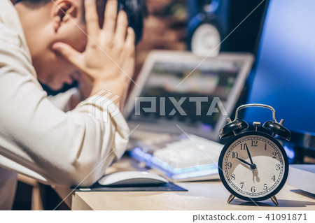 tired & headache asian businessman work overtime tired & headache asian businessman work overtime 41091871
