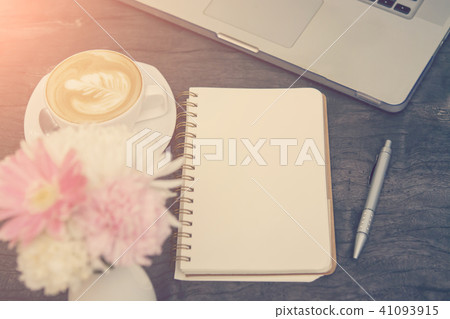 Blank notebook with laptop and pen on wood table, 41093915