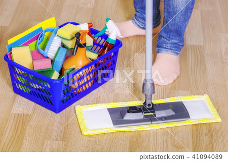 Woman uses mop on the floor Woman uses mop on the floor 41094089