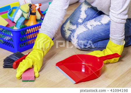 Woman with sponge clean floor 41094198