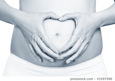 Pregnant woman holding her hands in a heart shape on belly. Pregnant woman holding her hands in a heart shape on belly. 41097996