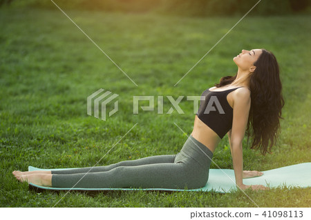 Young woman doing workout for stretching body. Young woman doing workout for stretching body. 41098113