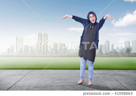 Excited asian muslim woman enjoying the day 41098663