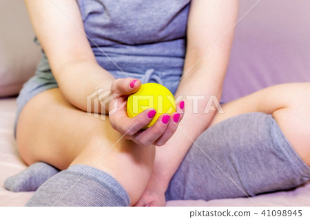 Woman squeezing stress ball 41098945