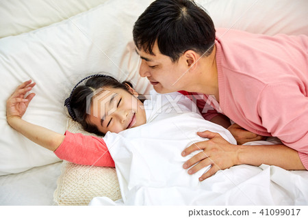 Dad wakes up sleeping in bed Dad wakes up sleeping in bed 41099017