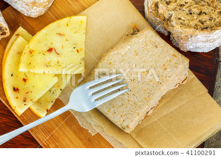 Fork on liver pate with bread and cheese 41100291