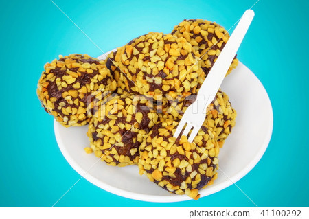 Chocolate rum balls on vintage blue 41100292