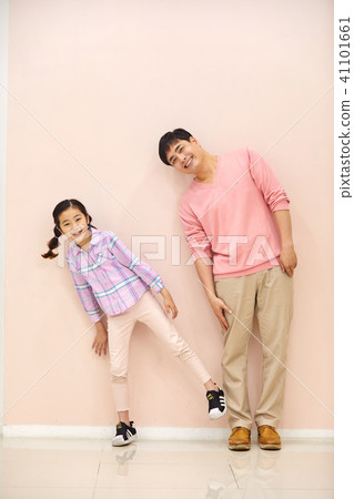 Dad and daughter playing happily in the living room Dad and daughter playing happily in the living room 41101661