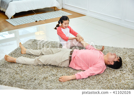 Lovely daughter waking up her napping dad Lovely daughter waking up her napping dad 41102026