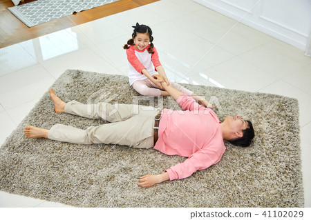 Lovely daughter waking up her napping dad 41102029