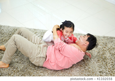 Lovely daughter waking up her napping dad 41102038