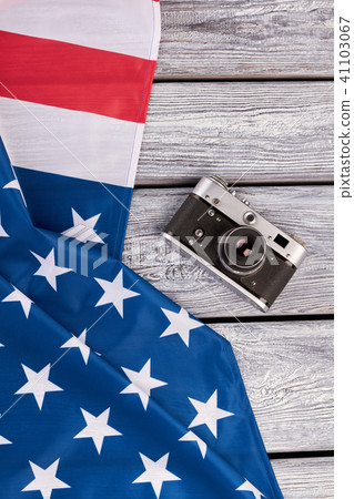 USA flag and vintage camera, top view. USA flag and vintage camera, top view. 41103067