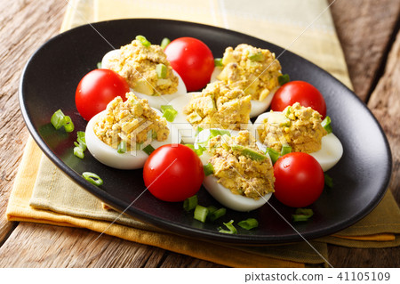 Stuffed deviled eggs with canned tuna and avocado 41105109
