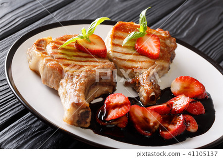 Pork steak fried on grill and balsamic strawberry Pork steak fried on grill and balsamic strawberry 41105137
