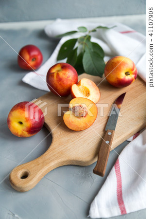 Ripe peaches on the wooden desk. Summer Ripe peaches on the wooden desk. Summer 41107908