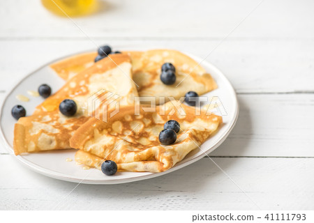 Crepes with blueberries and honey 41111793
