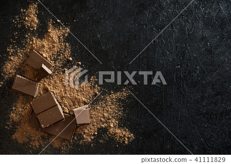 Chocolate pieces and cocoa powder Chocolate pieces and cocoa powder 41111829