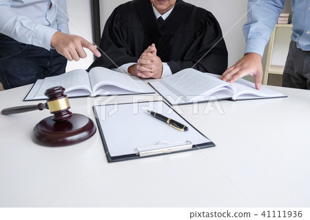 Close up of gavel, Male lawyer and older judge Consult with clie 41111936