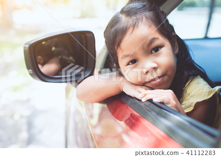 Cute asian little child girl traveling by car 41112283