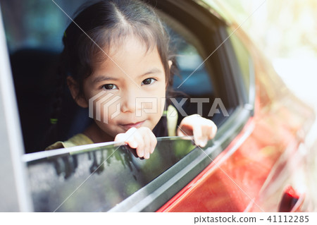 Cute asian little child girl traveling by car Cute asian little child girl traveling by car 41112285