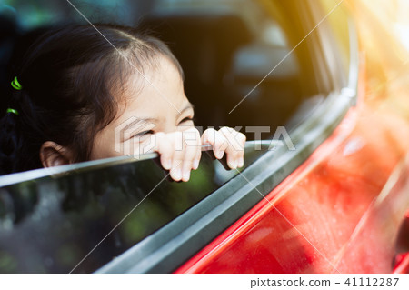 Cute asian little child girl traveling by car Cute asian little child girl traveling by car 41112287