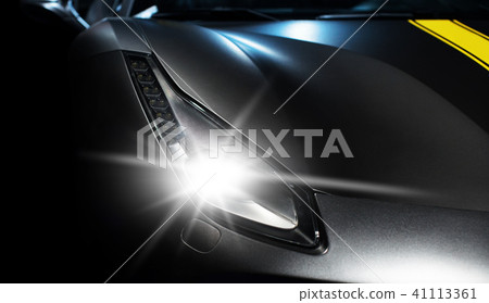 sports car headlight close-up 41113361