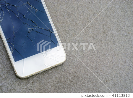 Close up modern mobile phone with broken screen 41113813