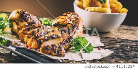 Grill chicken breast salt pepper parsley and herbs Grill chicken breast salt pepper parsley and herbs 41115284