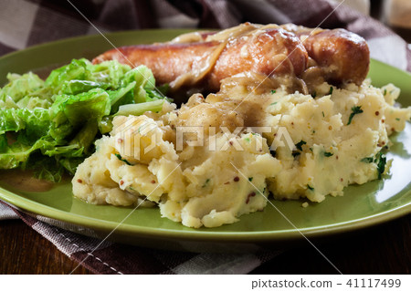 Bangers and Mash. Baked sausage in onion gravy 41117499