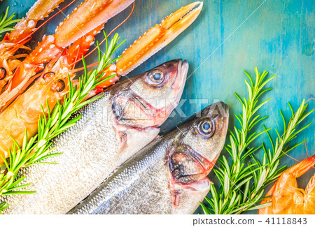 Fresh seafood on blue background Fresh seafood on blue background 41118843
