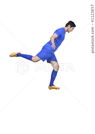 Side view of asian football player kicking the ball 41123657