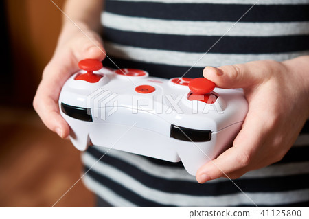 Child hands use remote control toy Child hands use remote control toy 41125800