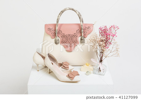 Female handbag, shoes and bouquet of dried flowers 41127099