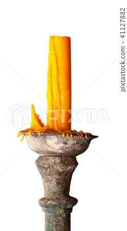 Candle on ancient candle holder. 41127882
