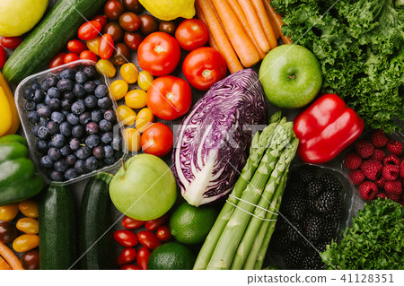 Different tasty vegetables on rough background 41128351