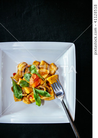 Potato gnocchi with spinach octopus and parmesan 41128518