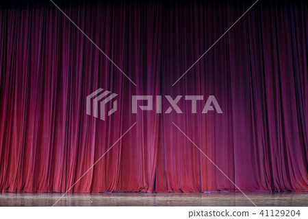 Red curtains and stage. 41129204