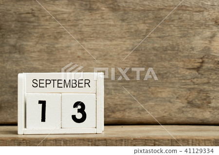 White block calendar present date 13 and September 41129334