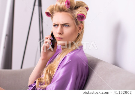 Young girl on her phone at home. Young girl on her phone at home. 41132902