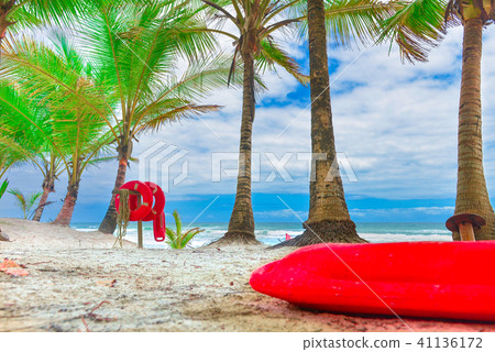 Red life buoy with rope and a flag Red life buoy with rope and a flag 41136172