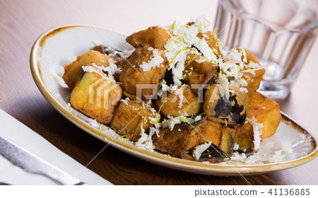 Plate with steamed eggplants with honey and cheese Plate with steamed eggplants with honey and cheese 41136885